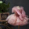 A one-year-old girl wore a pink short butterfly dress, a princess dress and a puffy dress to host a sweet stage performance